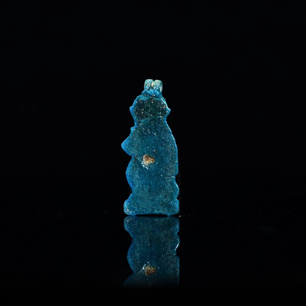 An Egyptian Faience Baboon Amulet, Third Intermediate Period, 21st Dynasty, ca. 900 - 700 BCE